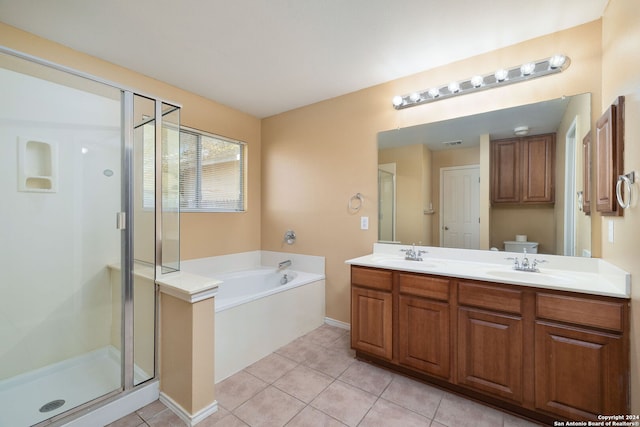 full bathroom with tile patterned floors, vanity, plus walk in shower, and toilet