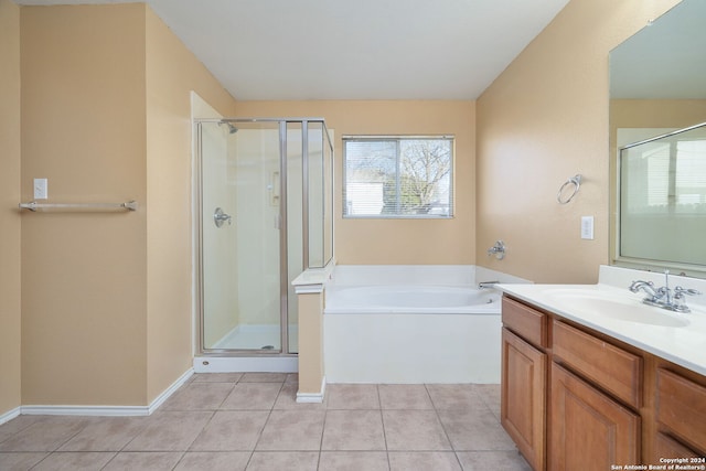 bathroom with tile patterned floors, separate shower and tub, and vanity