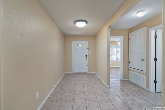 foyer entrance with light tile patterned floors