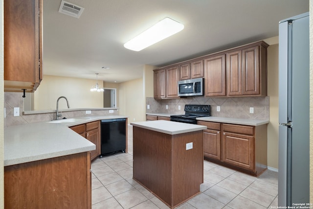 kitchen with a center island, a notable chandelier, kitchen peninsula, pendant lighting, and black appliances