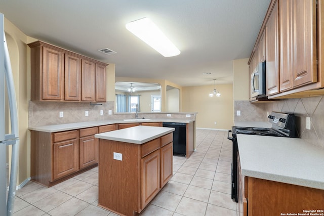 kitchen featuring dishwasher, hanging light fixtures, electric stove, a kitchen island, and ceiling fan with notable chandelier