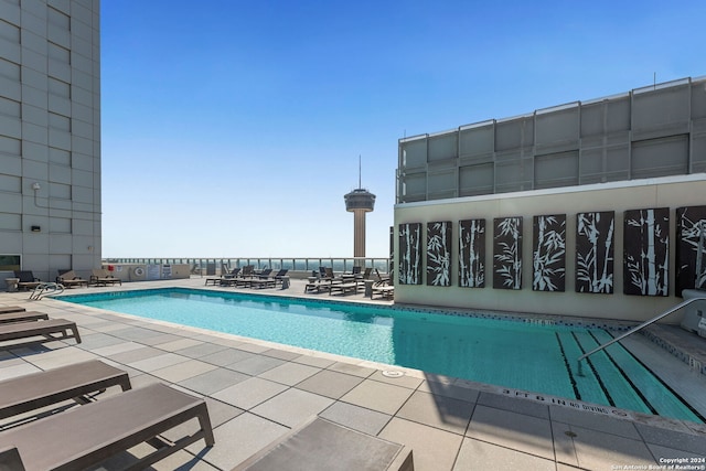 view of swimming pool with a patio