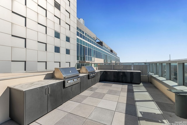 view of patio featuring grilling area and exterior kitchen