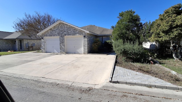 ranch-style home featuring a garage