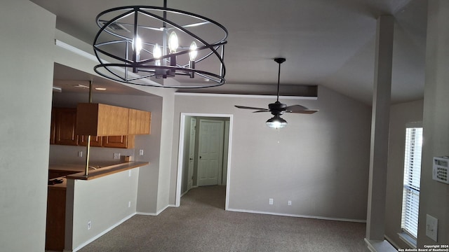 interior space featuring ceiling fan, carpet floors, brown cabinetry, and baseboards