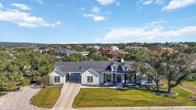 view of front of property featuring covered porch and a front yard