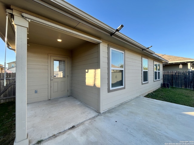 property entrance featuring a patio area