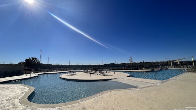 view of swimming pool featuring a patio