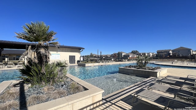 view of pool featuring a patio area