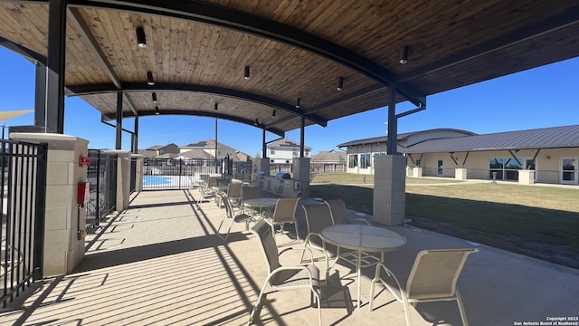 view of patio / terrace featuring a pool