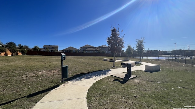 view of home's community featuring a yard