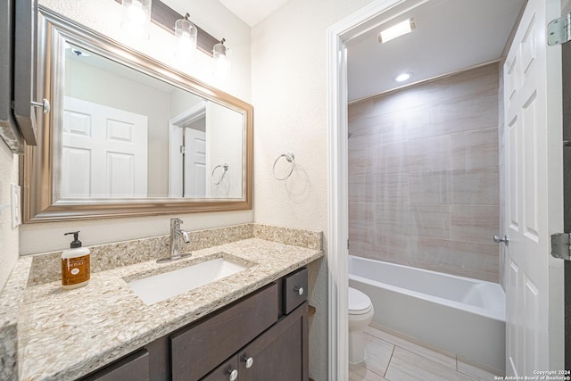 full bathroom featuring vanity, tiled shower / bath combo, and toilet