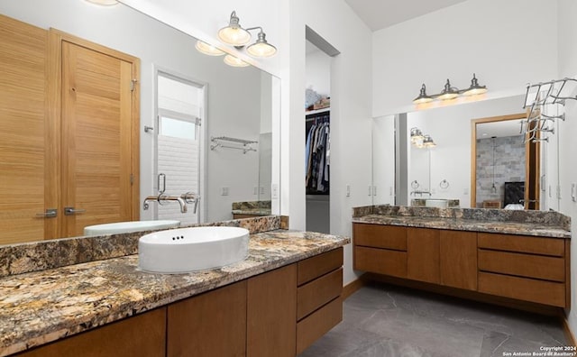 bathroom featuring vanity and a shower with shower door