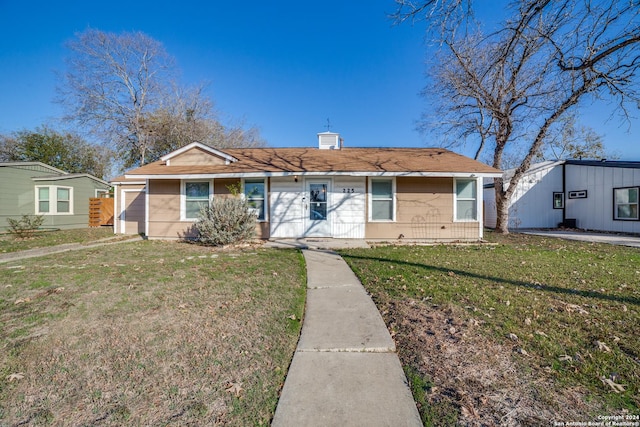 ranch-style house featuring a front lawn