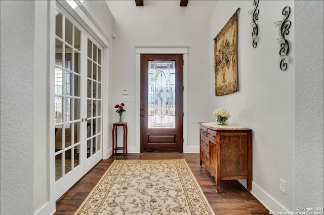 foyer entrance with french doors and dark hardwood / wood-style flooring