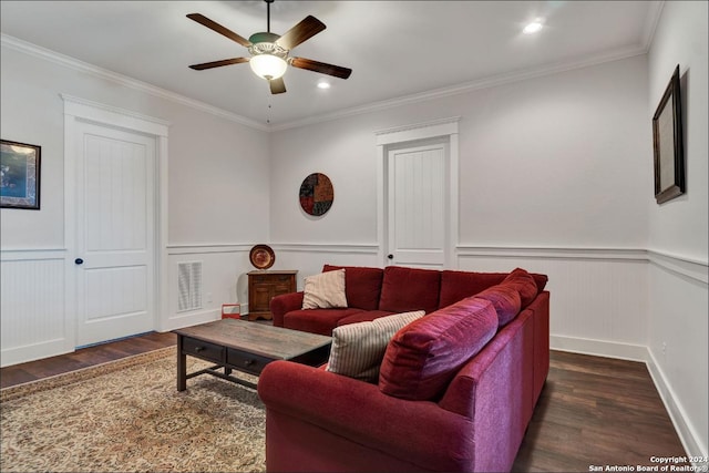 living room featuring dark hardwood / wood-style flooring, ceiling fan, and crown molding