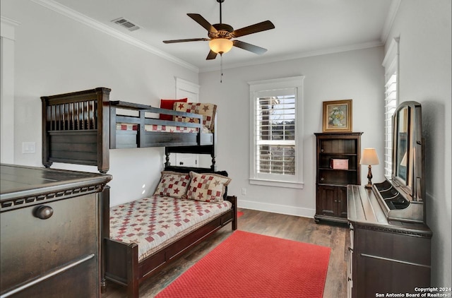 bedroom with ceiling fan, dark hardwood / wood-style flooring, and ornamental molding