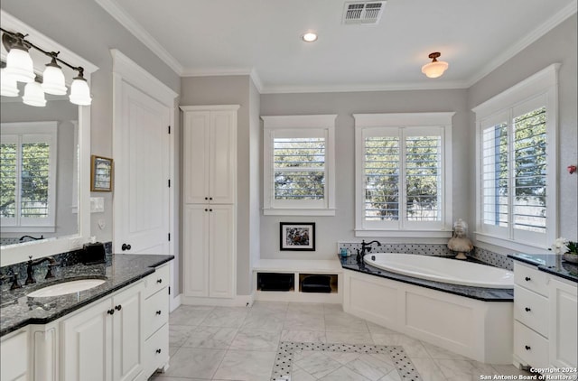 bathroom with a bath, vanity, and crown molding