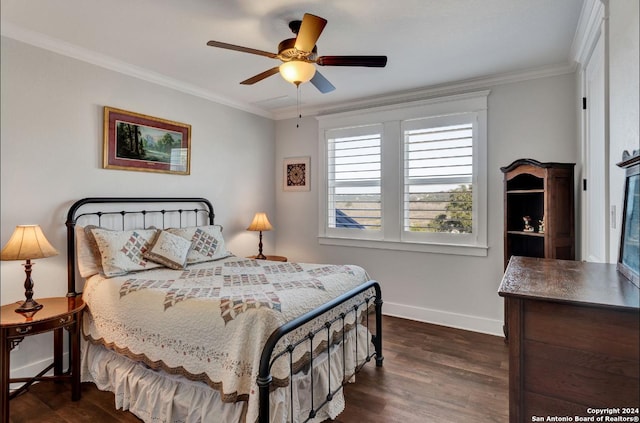 bedroom featuring dark hardwood / wood-style floors, ceiling fan, and ornamental molding