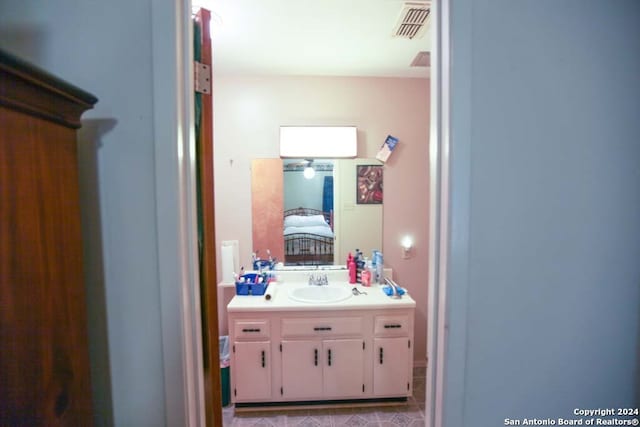 bathroom with tile patterned flooring and vanity