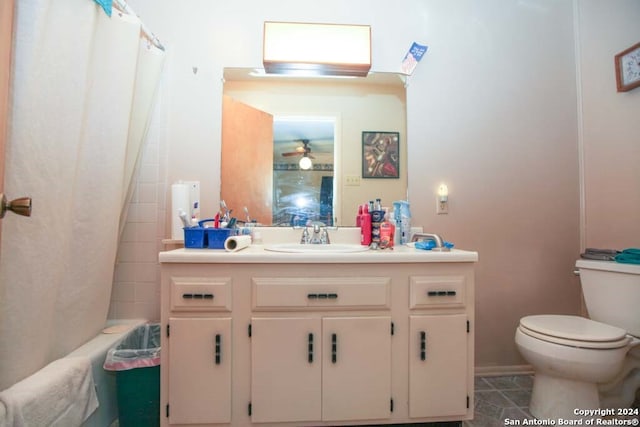 full bathroom featuring shower / bath combination with curtain, vanity, ceiling fan, tile patterned flooring, and toilet