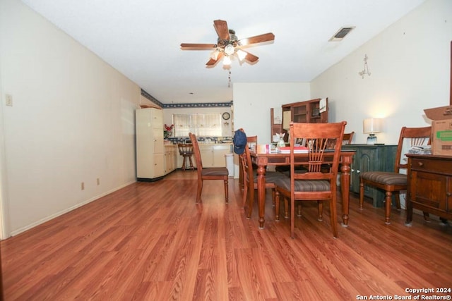 dining area featuring ceiling fan and hardwood / wood-style floors