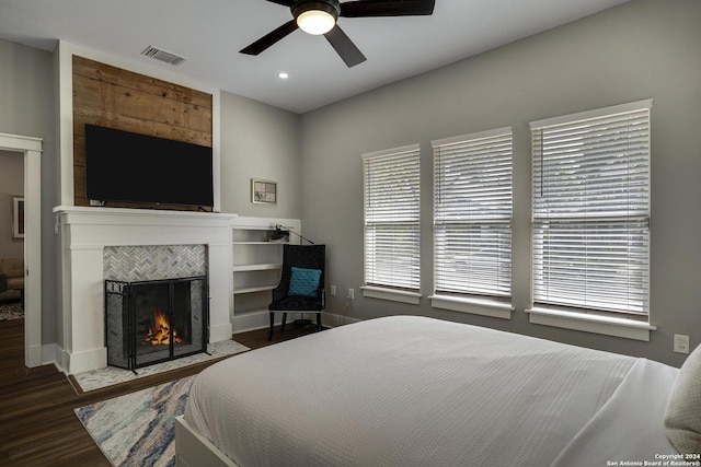 403 Queen Anne Ct, San Antonio, TX 78209 - bedroom featuring baseboards, visible vents, a tile fireplace, ceiling fan, and wood finished floors
