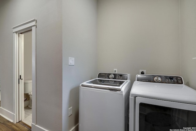 403 Queen Anne Ct, San Antonio, TX 78209 - washroom with washer and dryer, laundry area, and wood finished floors
