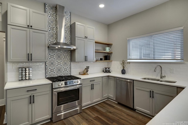403 Queen Anne Ct, San Antonio, TX 78209 - kitchen with dark wood-style flooring, gray cabinets, stainless steel appliances, wall chimney range hood, and a sink