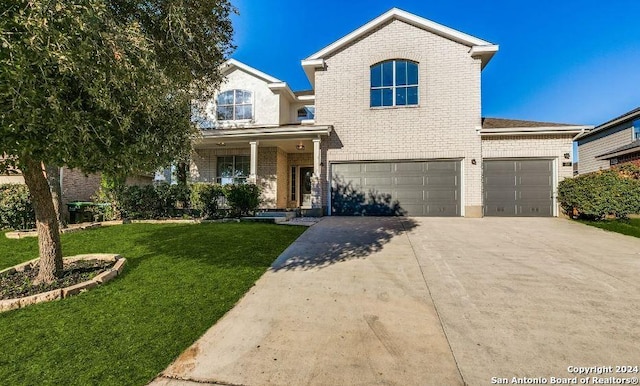 view of front property with a front yard and a garage