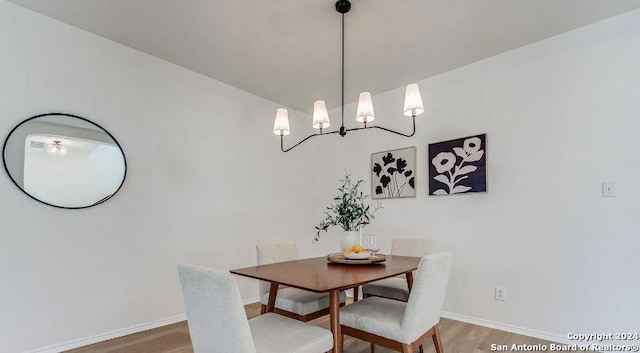 dining room with hardwood / wood-style flooring