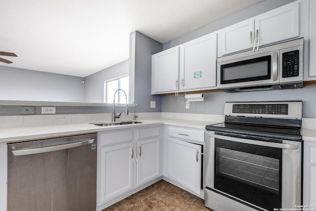 kitchen with sink, white cabinets, and stainless steel appliances