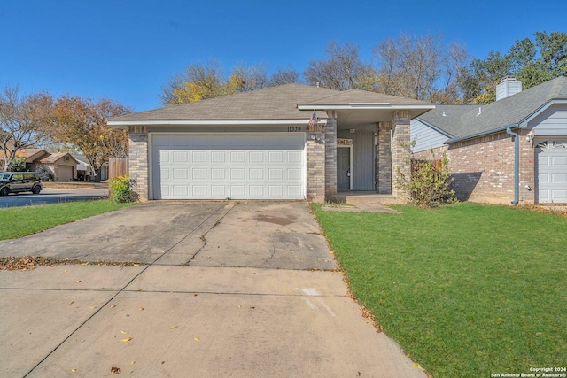 view of front facade featuring a front lawn and a garage