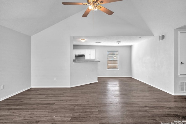 unfurnished living room with ceiling fan, dark hardwood / wood-style floors, and vaulted ceiling