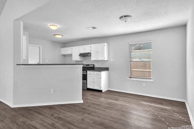 kitchen featuring stainless steel electric stove, dark hardwood / wood-style floors, white cabinets, and a textured ceiling