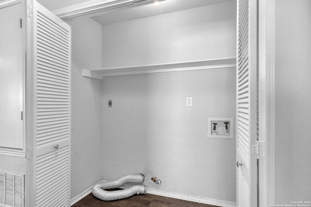 laundry area with hookup for an electric dryer, hookup for a washing machine, dark hardwood / wood-style flooring, and hookup for a gas dryer