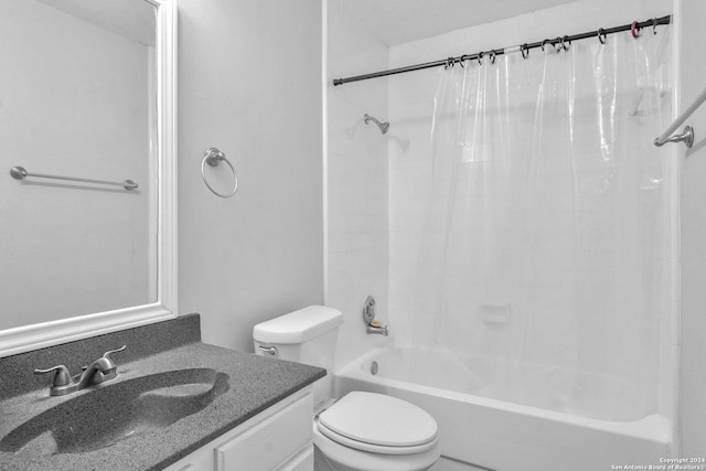 full bathroom with shower / bath combo, vanity, and toilet