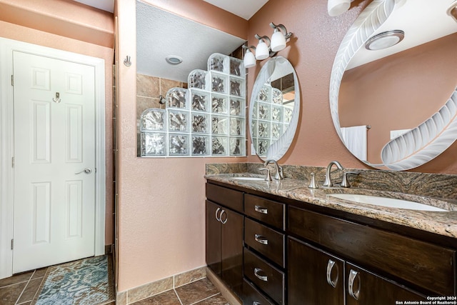 bathroom featuring tile patterned flooring and vanity