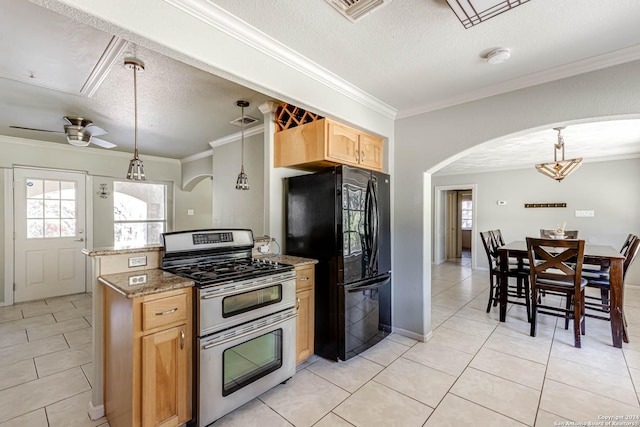 kitchen with ceiling fan, range with two ovens, a textured ceiling, and black fridge