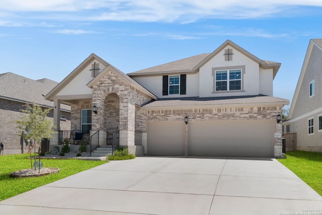 view of front of house featuring central AC unit, a garage, and a front lawn