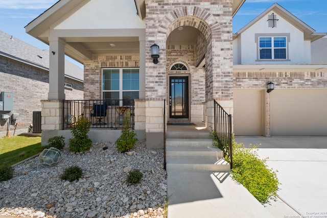 view of front of house featuring a garage and central AC unit