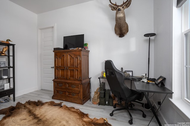 office area with light hardwood / wood-style flooring