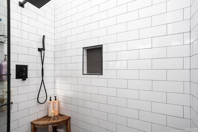 bathroom with a tile shower