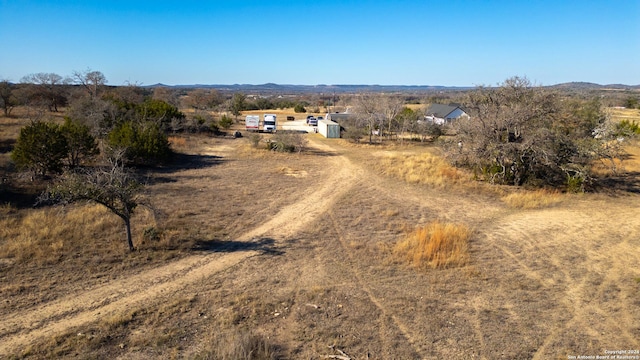 aerial view featuring a mountain view and a rural view