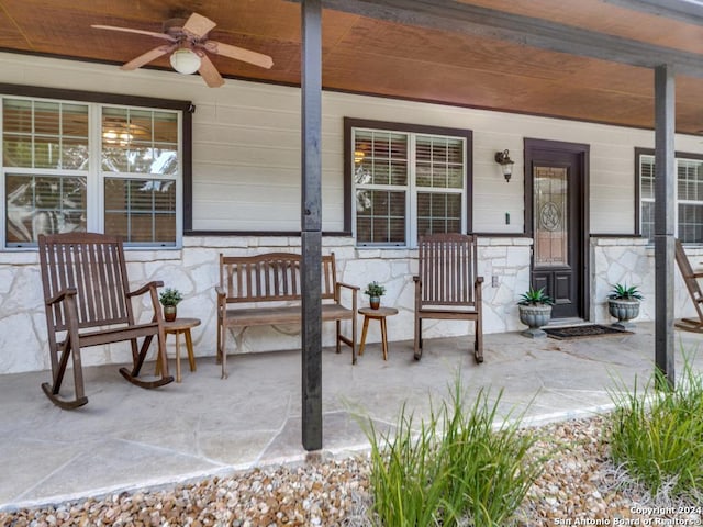 view of patio / terrace with ceiling fan and a porch