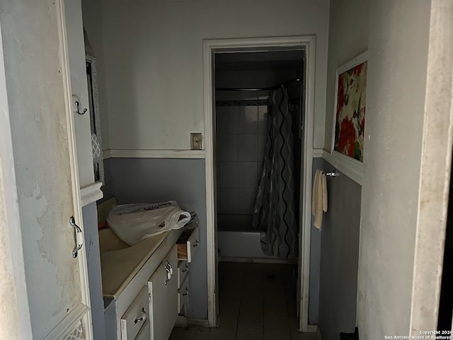 bathroom with tile patterned floors, vanity, and shower / bath combination with curtain