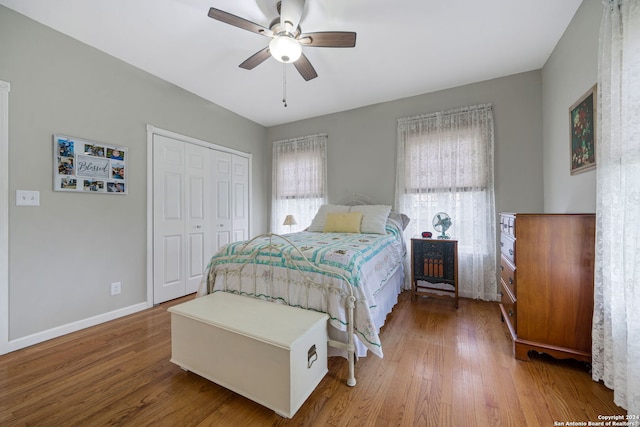 bedroom featuring a closet, ceiling fan, and hardwood / wood-style flooring