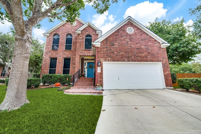 front of property with a garage and a front lawn