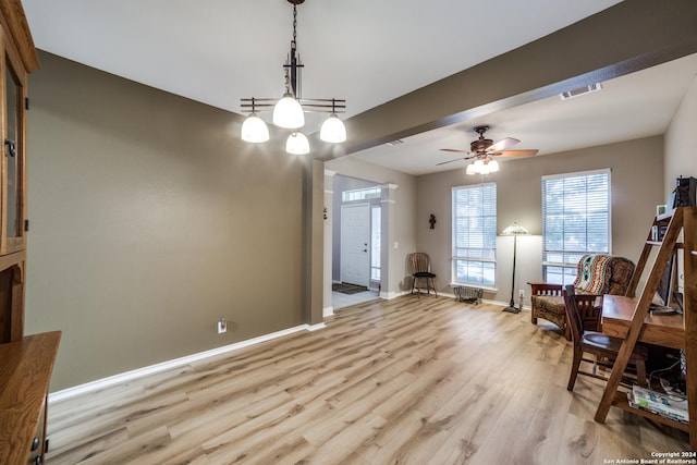 living area with ceiling fan and light wood-type flooring