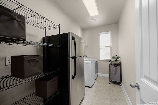 laundry room with separate washer and dryer